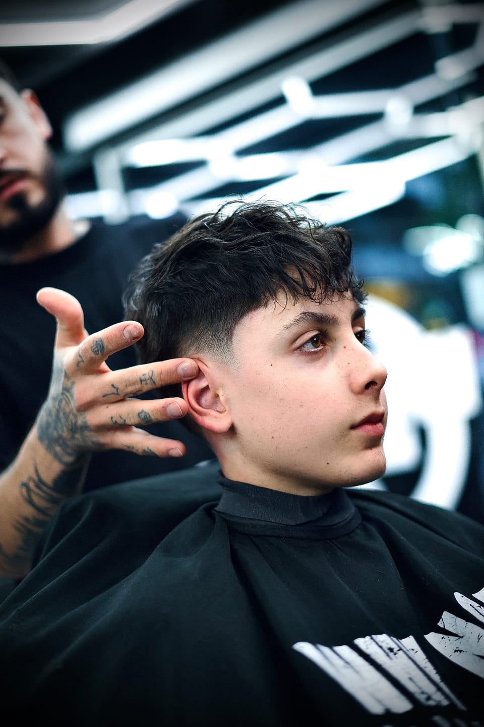 Corte infantil en silla booster en Why Not Eixample